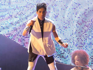 Prince re-signs with Warner Bros. and plans...
