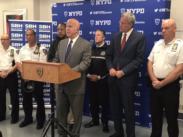 NYPD officer shot, killed while in patrol car