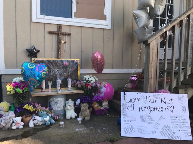 Mother accused of killing family gives thumbs-up in court