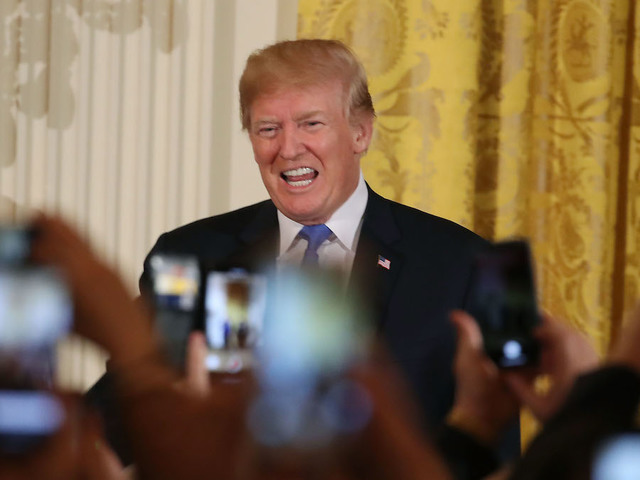 Trump signs spending bill after veto threat
