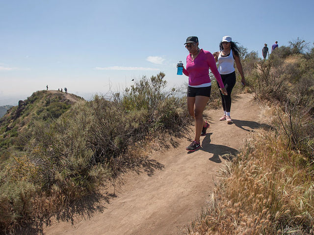 Heat wave builds in western US after leaving at least 20 dead in the East