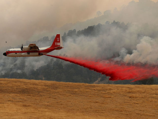 Fast-moving wildfire kills one in California, forces evacuations